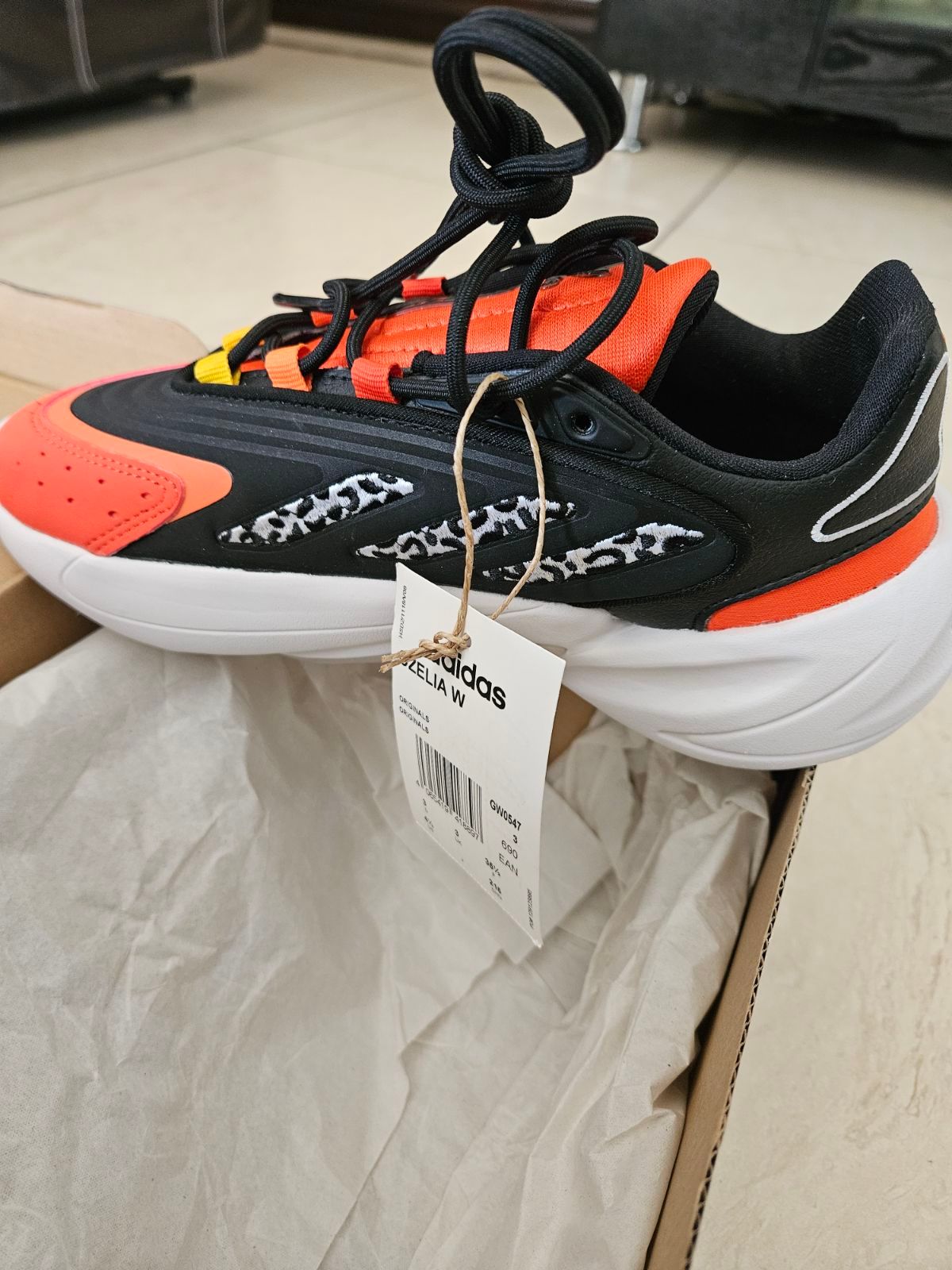 Women | Adidas Ozelia orange and black size 4 n | YAGA
